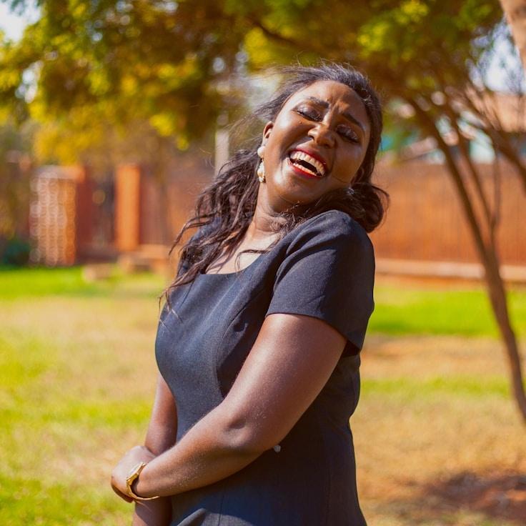 Mira Shah, Lead Design Curator at ModestParcelGuide, reviewing corporate floral arrangements